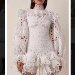 White ruffle dress long sleeve . Brand new never worn.